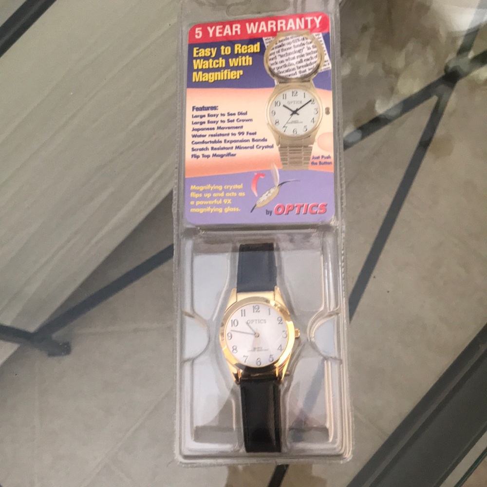 Optics quartz watch. New, magnifying crystal and‎ water resistant black band